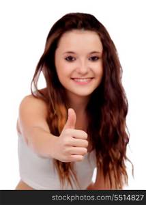 Young teenage saying Ok with focus on her thumb isolated on a white background