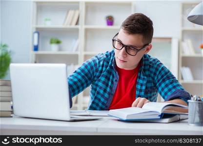 Young teenager preparing for exams studying at a desk indoors
