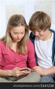 Young teenagers using mobile phone