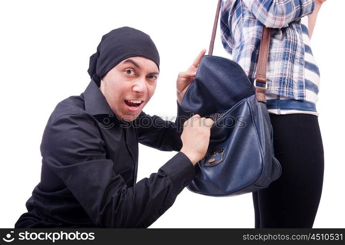 Young thief stealing woman's bag