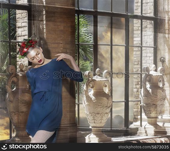 Young Thinking Woman in Blue Dress posing