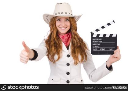 Young thumbing cowgirl with movie board isolated on white