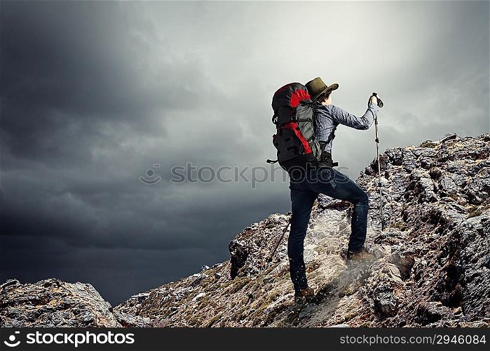 Young tourist atop of mountain