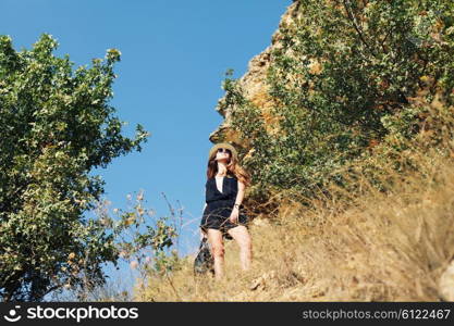 Young tourist woman. Female model wearing fashionable clothes