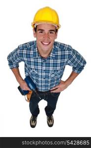 Young tradesman holding a power tool