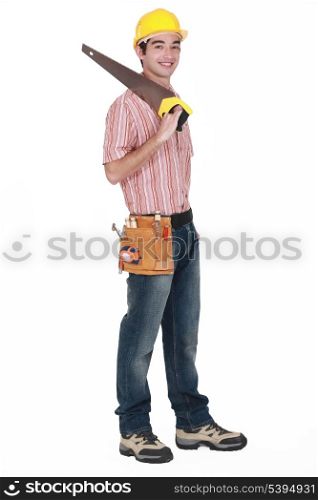 Young tradesman holding a saw