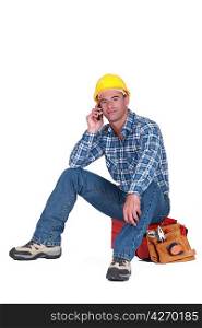 young tradesman on the phone with customer