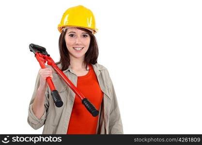 Young tradeswoman holding large clippers