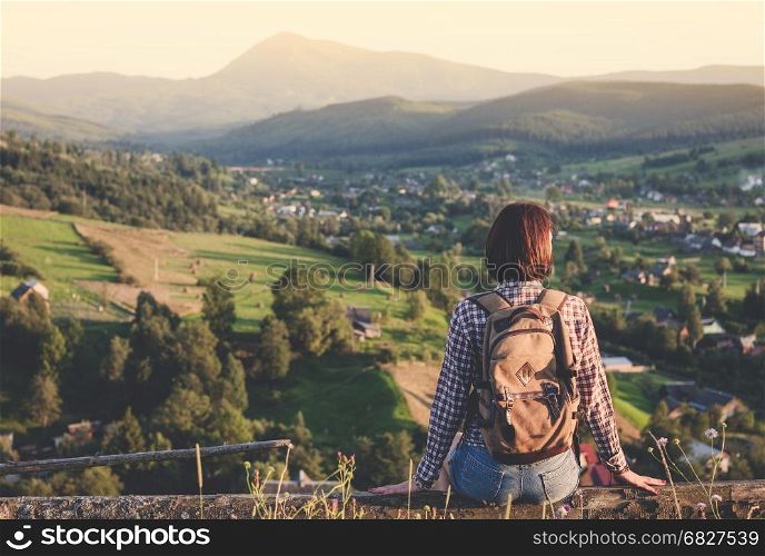 Young travel girl enjoying mountain view