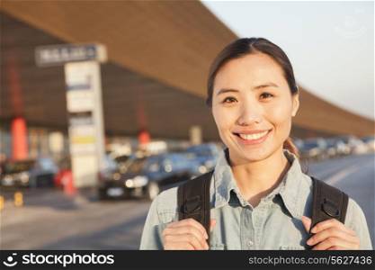 Young traveler portrait outside of airport
