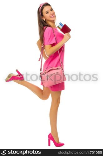 Young traveling girl in pink dress isolated