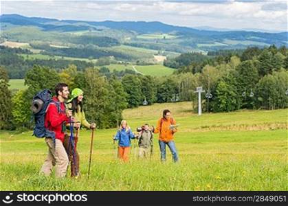 Young trekking people enjoying nature and scenic landscape