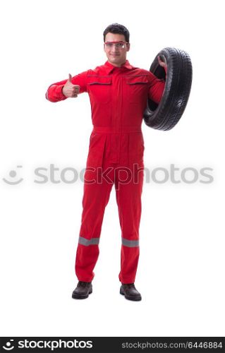 Young tyre repairman in red coveralls isolated on white background. Young tyre repairman in red coveralls isolated on white backgrou