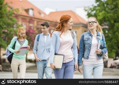 Young university friends walking on street
