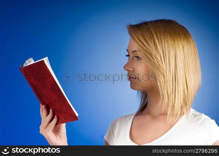 Young university student with many study textbooks