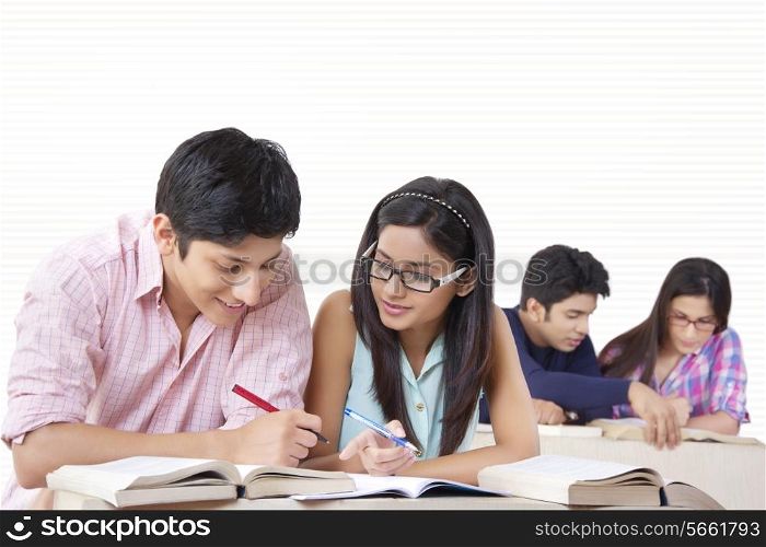 Young university students studying in classroom