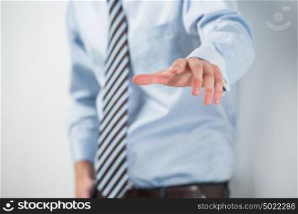 Young unrecognizable business man touching virtual button. Editable image