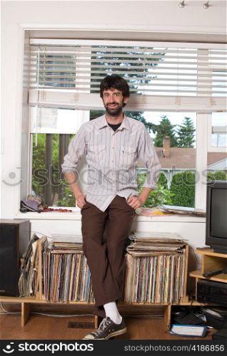 Young Urban Hipster with Record Collection