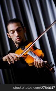 Young violin player playing