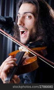 Young violin player playing