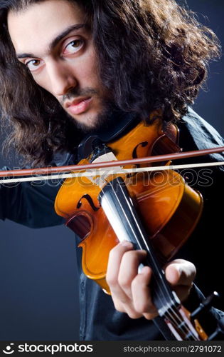 Young violin player playing