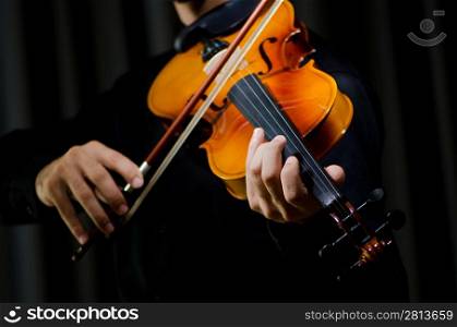 Young violin player playing