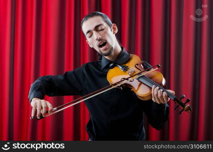 Young violin player playing