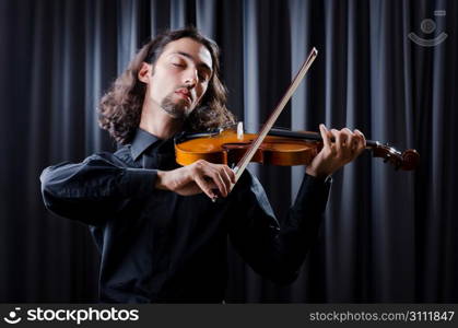 Young violin player playing