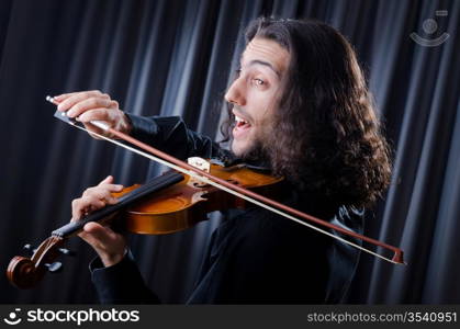 Young violin player playing