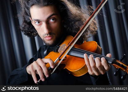 Young violin player playing