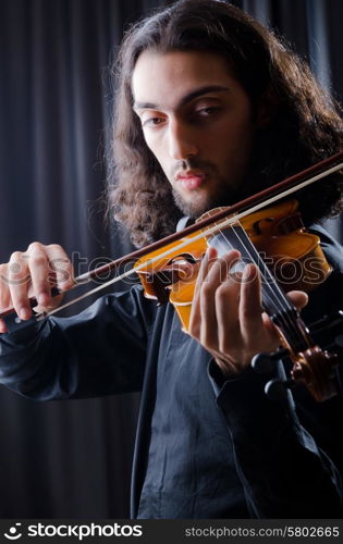 Young violin player playing