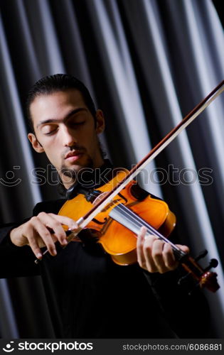 Young violin player playing