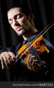 Young violin player playing