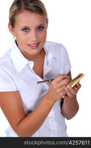 Young waitress with an order pad