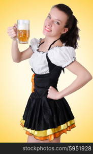 Young waitress with beer on white