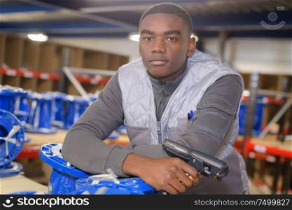 young warehouse worker scanning