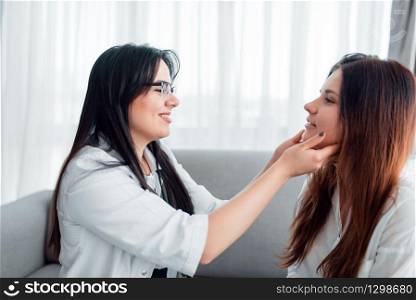 Young wife at family doctor reception. Specialist examines female patient, professional health care. Young wife at family doctor reception