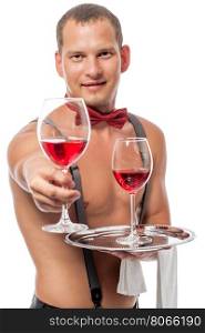 young with a naked torso bartender gives a glass of red wine