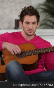 young with Spanish guitar