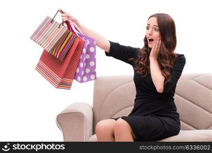 Young woman after christmas shopping on white