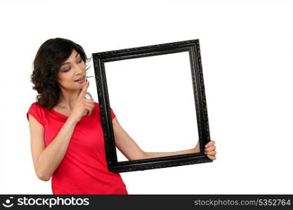 young woman and a wooden frame