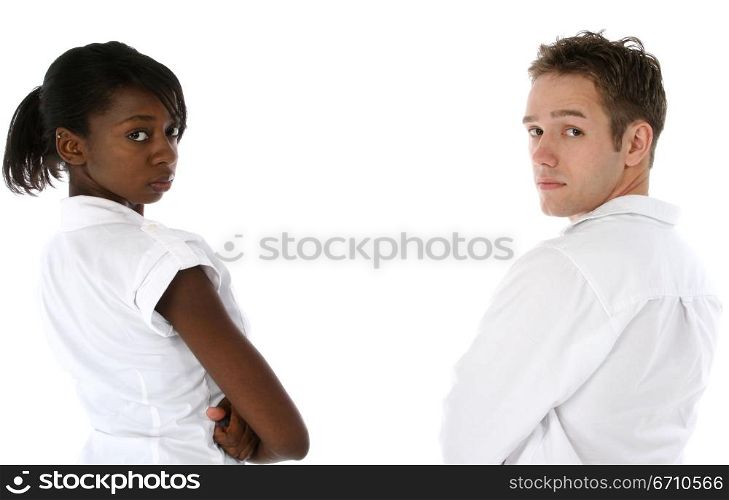 Young woman and a young man standing with their arms crossed