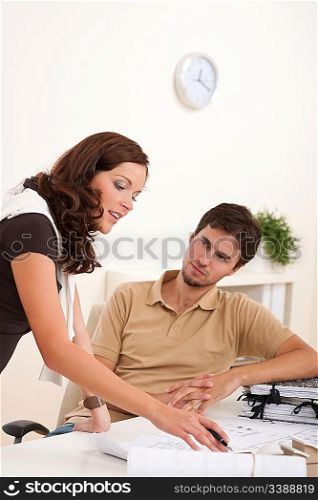 Young woman and man at office working together