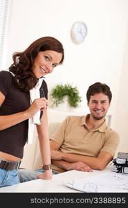 Young woman and man at office working together
