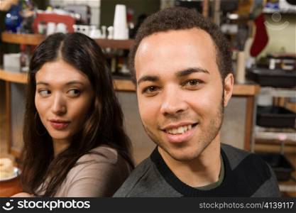 Young Woman and Man Back-to-back