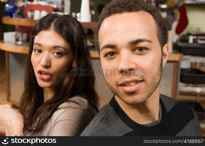 Young Woman and Man Back-to-back