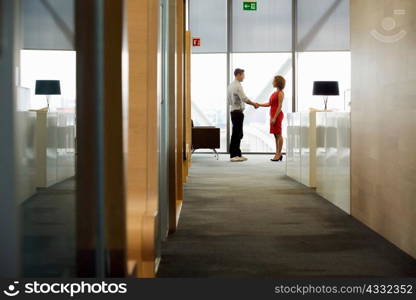 Young woman and man meeting in office