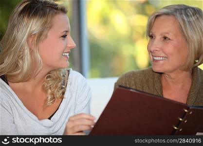 young woman and older woman at restaurant