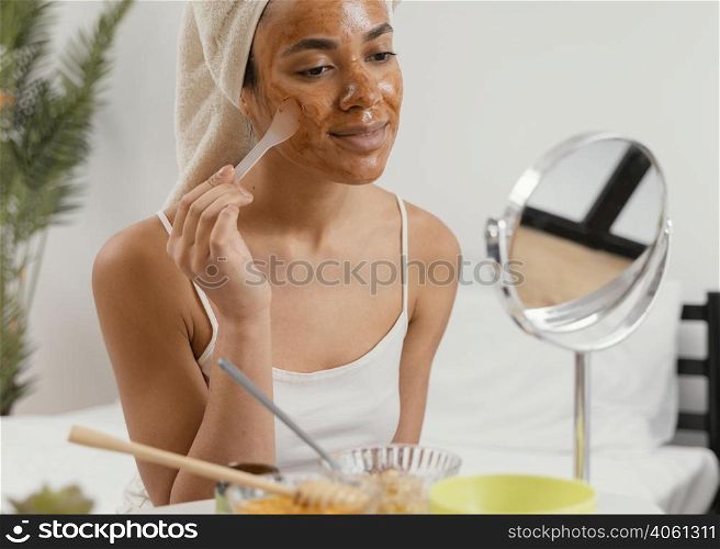 young woman applying natural face mask 4