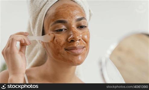 young woman applying natural face mask 5